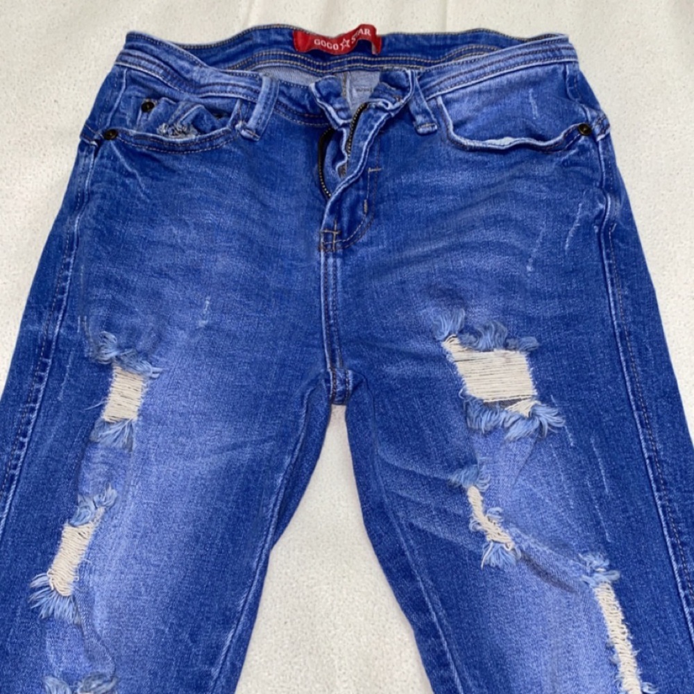 Ripped bright blue jeans